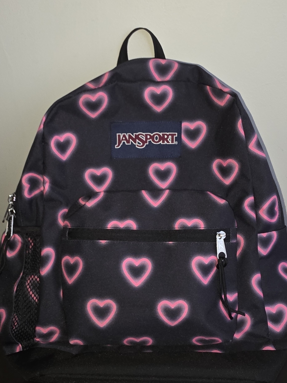Jansport Black Backpack with Neon Pink Heart Pattern